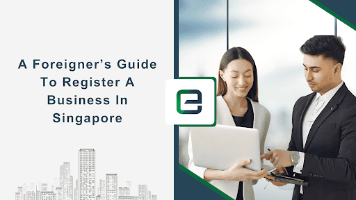 Two business professionals discussing company registration plans in a modern Singapore office, representing the process of setting up a business as a foreign entrepreneur.