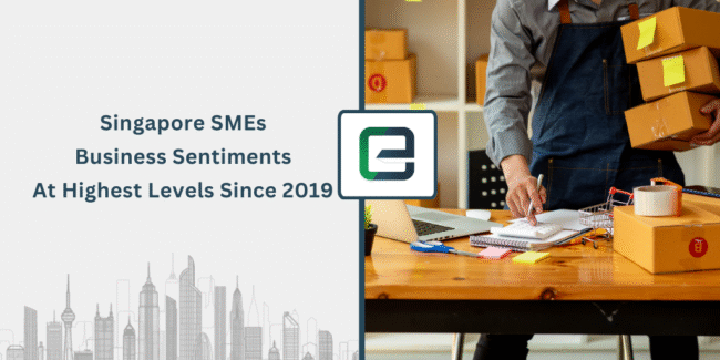Singapore SMEs Report Highest Business Confidence Since 2019 ingapore SME business sentiment 2025 – man managing e-commerce packaging, parcels, and logistics on desk with laptop, highlighting post-pandemic growth and confidence in small business economy.