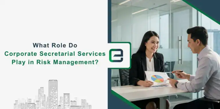 Two business professionals discussing a pie chart report in a modern office, illustrating the role of corporate secretarial services in risk management.